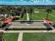 Enjoy a relaxing game on the meticulously maintained bocce ball court surrounded by lush landscaping and sunny skies at 223 Silver Maple Rd, Groveland, FL 34736