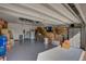 Spacious garage filled with boxes and storage items on the floor at 223 Silver Maple Rd, Groveland, FL 34736