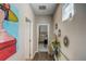 Hallway features hardwood floors, stylish decor, and a glimpse into the living space at 223 Silver Maple Rd, Groveland, FL 34736