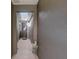 Hallway leading to the front door with neutral decor at 223 Silver Maple Rd, Groveland, FL 34736