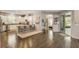 Beautiful kitchen with stainless steel appliances, island with seating, and hardwood floors at 223 Silver Maple Rd, Groveland, FL 34736