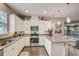 Well-equipped kitchen with stainless steel appliances and a central island at 223 Silver Maple Rd, Groveland, FL 34736