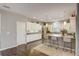 Modern kitchen featuring stainless steel appliances, an island with seating, and white cabinets at 223 Silver Maple Rd, Groveland, FL 34736