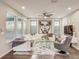 Bright living room with hardwood floors, modern furnishings and neutral color palette at 223 Silver Maple Rd, Groveland, FL 34736