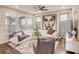 Welcoming living room with hardwood floors, modern decor, and plenty of natural light at 223 Silver Maple Rd, Groveland, FL 34736