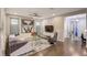 Spacious living room featuring hardwood floors, modern furnishings and neutral color palette at 223 Silver Maple Rd, Groveland, FL 34736