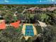 Community pickleball court viewed from above, surrounded by shade trees at 223 Silver Maple Rd, Groveland, FL 34736