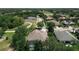 An aerial view of a home situated on a tree-lined street in a friendly neighborhood at 2332 Pond Cove Way, Apopka, FL 32712