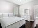 Cozy bedroom featuring a comfortable bed, dresser, and hardwood floors at 2332 Pond Cove Way, Apopka, FL 32712