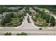 A beautifully landscaped entrance welcomes residents and guests to this desirable community at 2332 Pond Cove Way, Apopka, FL 32712