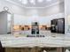 Bright kitchen featuring granite countertops, white cabinets and stainless steel appliances at 2332 Pond Cove Way, Apopka, FL 32712