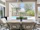 A covered patio with dining furniture overlooking the pool at 2332 Pond Cove Way, Apopka, FL 32712