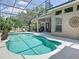 A sparkling pool area with a screened enclosure and exterior views of the home at 2332 Pond Cove Way, Apopka, FL 32712