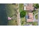 Overhead view of a home with a private beach, dock, and screened in pool at 2501 Trentwood Blvd, Belle Isle, FL 32812