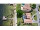 Waterfront home with a private pool, sandy beach, and a long dock at 2501 Trentwood Blvd, Belle Isle, FL 32812