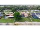 Backyard with a screened-in pool, a large tree, and a private beach and dock at 2501 Trentwood Blvd, Belle Isle, FL 32812