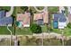 Aerial view of the home with a private dock and a lush backyard at 2501 Trentwood Blvd, Belle Isle, FL 32812