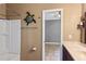 Functional bathroom with bathtub, toilet, sink and decorative turtle on wall at 2501 Trentwood Blvd, Belle Isle, FL 32812