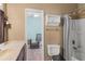 Well-maintained bathroom features a sink, toilet, and shower at 2501 Trentwood Blvd, Belle Isle, FL 32812