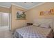 Comfortable bedroom with a plush bed, neutral walls, and modern accents at 2501 Trentwood Blvd, Belle Isle, FL 32812