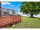 Relaxing wood deck overlooking the lake, with views of the screened-in lanai and a boat dock at 2501 Trentwood Blvd, Belle Isle, FL 32812