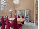Formal dining room with elegant display cases, large windows, and marble floors at 2501 Trentwood Blvd, Belle Isle, FL 32812