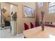 Dining room with an elegant table and chairs, decorative fireplace, and views of the staircase at 2501 Trentwood Blvd, Belle Isle, FL 32812