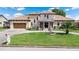 Beautiful home featuring a well-manicured lawn, water fountain, and a circular driveway at 2501 Trentwood Blvd, Belle Isle, FL 32812