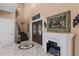 Grand foyer featuring marble floors, a decorative fireplace, and elegant staircase at 2501 Trentwood Blvd, Belle Isle, FL 32812