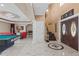 Spacious foyer with marble floors, high ceilings, and access to the game room at 2501 Trentwood Blvd, Belle Isle, FL 32812