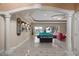 Open game room with a pool table, wet bar, and views of the pool and lake at 2501 Trentwood Blvd, Belle Isle, FL 32812