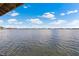 Picturesque view of the tranquil lake from the boat dock, capturing the serene essence of waterfront living at 2501 Trentwood Blvd, Belle Isle, FL 32812