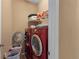 Brightly lit laundry room with full size washer and dryer at 2501 Trentwood Blvd, Belle Isle, FL 32812