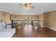 Open loft area featuring dark wood floors, railing, and lots of natural light at 2501 Trentwood Blvd, Belle Isle, FL 32812