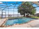 Screened in pool with a scenic waterfront view at 2501 Trentwood Blvd, Belle Isle, FL 32812