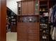 Custom closet with drawers, shelves, and hanging storage providing ample space for clothing and accessories at 25519 Hawks Run Ln, Sorrento, FL 32776