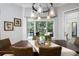 Dining area with a wooden table, seating for six, stylish pendant lighting, and views of the pool at 25519 Hawks Run Ln, Sorrento, FL 32776