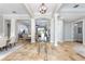 Elegant foyer features travertine tile, decorative columns, high ceilings, and an open floor plan at 25519 Hawks Run Ln, Sorrento, FL 32776