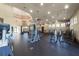 Spacious community gym featuring treadmills, weight machines, and free weights under a skylight at 25519 Hawks Run Ln, Sorrento, FL 32776