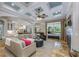 Spacious living room featuring coffered ceilings, a fireplace, and an open floor plan at 25519 Hawks Run Ln, Sorrento, FL 32776