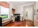 Bright home office space with natural light, hardwood floors, and a practical workstation setup at 25519 Hawks Run Ln, Sorrento, FL 32776
