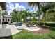 Expansive backyard with a sparkling pool, lush tropical landscaping, and an outdoor dining area at 25519 Hawks Run Ln, Sorrento, FL 32776