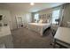 Comfortable bedroom with plush carpeting, lots of natural light, and neutral decor at 2825 Muller Oak Loop, Ocoee, FL 34761