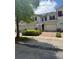 Well-maintained townhouses boast brick driveways, attached garages and manicured landscaping at 3181 Capri Isle Way, Orlando, FL 32835