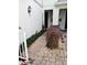 Paver walkway leads to the entrance of the home, with mature landscaping at 3181 Capri Isle Way, Orlando, FL 32835
