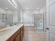 Spacious bathroom features double sinks, a bathtub, and a glass-enclosed shower at 3505 Rhapsody St, St Cloud, FL 34772