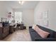 Cozy bedroom featuring a workstation, neutral walls, tile floors, and stylish decor for work or relaxation at 3505 Rhapsody St, St Cloud, FL 34772