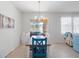 Bright dining area with a chandelier and view of the backyard patio at 3505 Rhapsody St, St Cloud, FL 34772