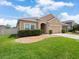 Well-kept single-Gathering home showcasing a green lawn, and a two-car garage at 3505 Rhapsody St, St Cloud, FL 34772