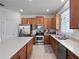 Well-lit kitchen with stainless steel appliances and generous cabinet space at 3505 Rhapsody St, St Cloud, FL 34772